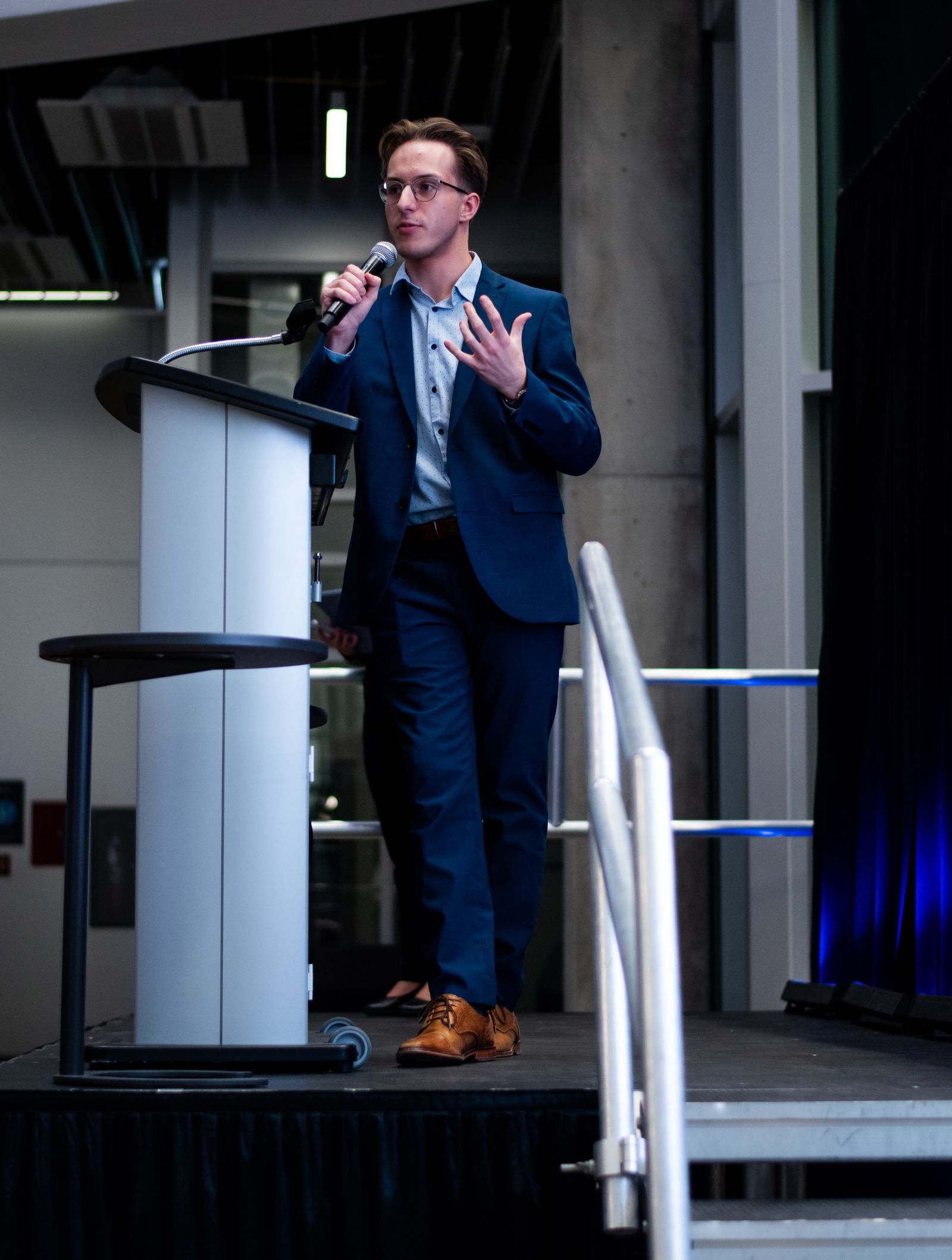 Daniel Berg on stage at NAIT's Pitch it to Me competition, 2025
