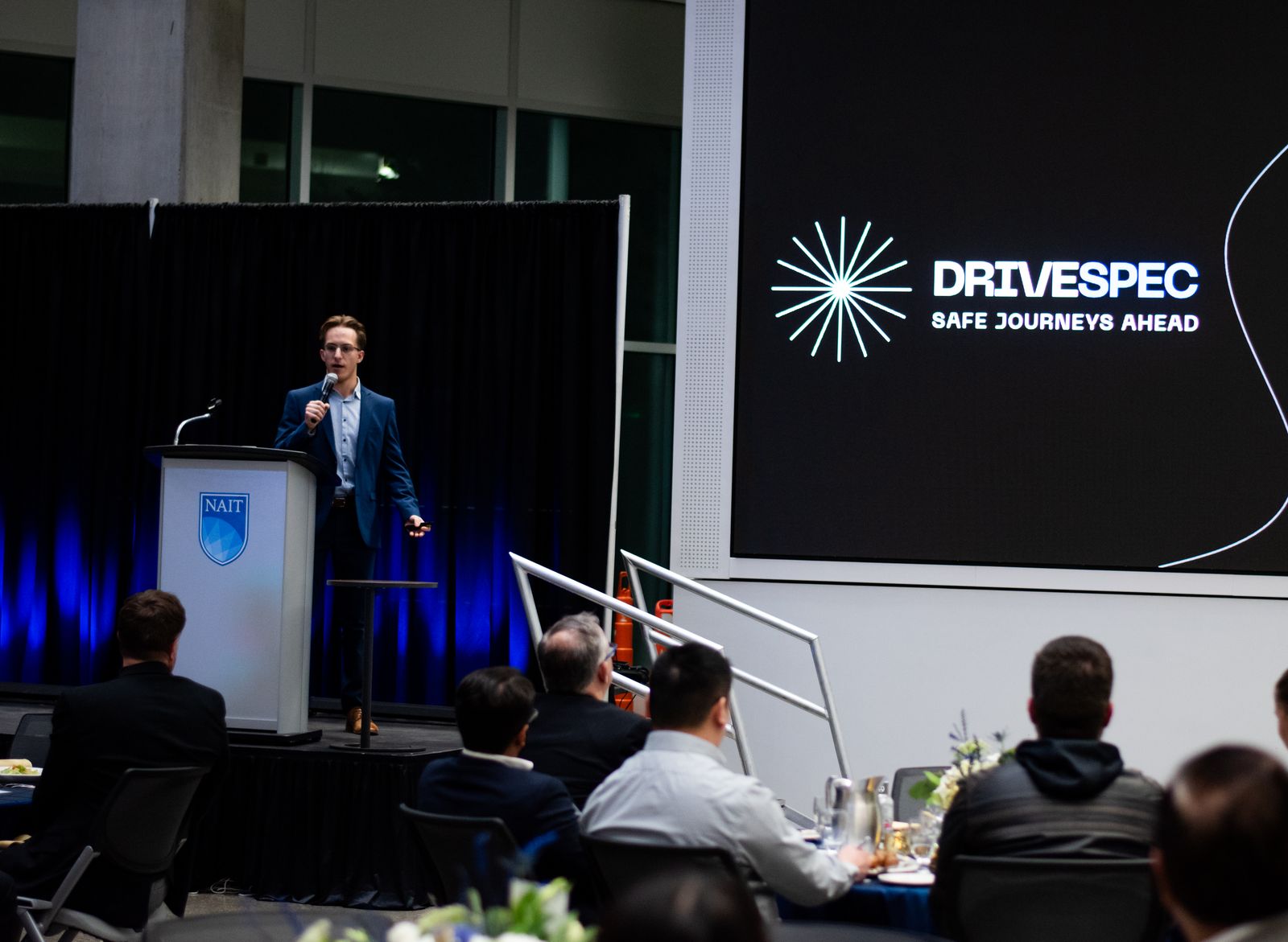 Daniel Berg presenting DriveSpec at NAIT's Pitch it to Me competition, 2025
